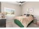 Stylish bedroom featuring a cozy bed, window with shutters, and modern decor at 4037 E Elmwood St, Mesa, AZ 85205