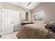 Bright bedroom featuring a comfortable bed, neutral colors, and ample natural light from the window at 4037 E Elmwood St, Mesa, AZ 85205