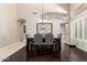 Formal dining room with elegant dark wood table and stylish decor at 4037 E Elmwood St, Mesa, AZ 85205