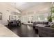 Bright and airy living room with hardwood floors and modern gray furnishings, perfect for entertaining at 4037 E Elmwood St, Mesa, AZ 85205