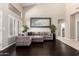 Comfortable living room with large windows, dark wood floors and stylish furnishings at 4037 E Elmwood St, Mesa, AZ 85205