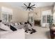 Cozy living room with fireplace, plush seating, and neutral tones offers a relaxing atmosphere at 4037 E Elmwood St, Mesa, AZ 85205
