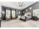 Expansive main bedroom featuring an oversized window, and a cozy sitting area at 4037 E Elmwood St, Mesa, AZ 85205