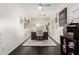 Spacious home office with a desk, decorative artwork, and a comfortable chair for a productive workspace at 4037 E Elmwood St, Mesa, AZ 85205