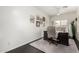 A home office offers a tranquil workspace with neutral tones, stylish decor, and a comfortable chair at 4037 E Elmwood St, Mesa, AZ 85205