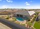 Aerial view of a luxurious backyard featuring a large pool, spa, outdoor kitchen, and patio at 42161 N Via Cienna --, San Tan Valley, AZ 85140