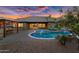 Backyard oasis featuring a pool, outdoor kitchen, and beautifully landscaped seating area for relaxing and entertaining at 42161 N Via Cienna --, San Tan Valley, AZ 85140