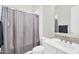 Neutral bathroom featuring a sink, mirror, tiled backsplash, toilet, shower, and towel, creating a functional space at 42161 N Via Cienna --, San Tan Valley, AZ 85140