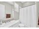 Well-lit bathroom featuring a sink, shower, toilet, and window, creating a functional and clean space at 42161 N Via Cienna --, San Tan Valley, AZ 85140