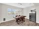 Cozy dining area with a wooden table, modern lighting, and stainless steel refrigerator at 42161 N Via Cienna --, San Tan Valley, AZ 85140