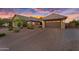 Wide brick paved driveway leading to a three-car garage, offering convenient access and curb appeal at 42161 N Via Cienna --, San Tan Valley, AZ 85140