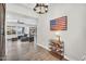 Elegant entryway with tile flooring, decorative shelving and rustic American flag decor at 42161 N Via Cienna --, San Tan Valley, AZ 85140