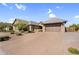 Charming single-story home featuring desert landscaping, a brick paver driveway and a two-car garage at 42161 N Via Cienna --, San Tan Valley, AZ 85140