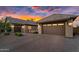 Spacious three-car garage with brick paved drive, providing ample parking and storage space at 42161 N Via Cienna --, San Tan Valley, AZ 85140