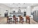 Modern kitchen with a large island, stainless steel appliances, and stylish backsplash at 42161 N Via Cienna --, San Tan Valley, AZ 85140