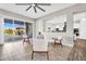 Bright living area featuring tile floors, modern furniture, and access to the outdoor patio at 42161 N Via Cienna --, San Tan Valley, AZ 85140