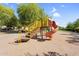 Community playground with a slide and climbing structure in a sand-filled area at 42161 N Via Cienna --, San Tan Valley, AZ 85140