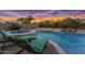 Relaxing backyard featuring a pool, hot tub, and lounge chairs, perfect for enjoying the outdoors at 42161 N Via Cienna --, San Tan Valley, AZ 85140