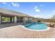 Beautiful backyard swimming pool and patio area with spa and manicured landscaping at 42161 N Via Cienna --, San Tan Valley, AZ 85140