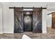 Interior safe room behind rustic barn doors with an intricate locking mechanism for added security at 42161 N Via Cienna --, San Tan Valley, AZ 85140