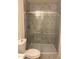 Modern bathroom with marble tiled shower and sliding glass door at 4533 N 17Th Ave, Phoenix, AZ 85015