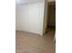 Bedroom interior with wood-look flooring and white closet doors at 4533 N 17Th Ave, Phoenix, AZ 85015