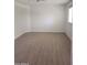 Bedroom featuring wood-look flooring, a window with blinds, and a ceiling fan at 4533 N 17Th Ave, Phoenix, AZ 85015
