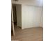 Clean bedroom with wood-look flooring and a closet featuring sliding doors at 4533 N 17Th Ave, Phoenix, AZ 85015
