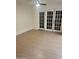 Living Room featuring wood flooring and white-frame sliding glass doors at 4533 N 17Th Ave, Phoenix, AZ 85015
