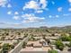 Wide aerial shot showcasing the community, local mountains, and blue skies at 4701 W Fallen Leaf Ln, Glendale, AZ 85310