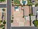 Aerial view of backyard, featuring a pool, patio, and lush landscaping at 4701 W Fallen Leaf Ln, Glendale, AZ 85310