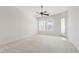 Bright bedroom with neutral carpet and large windows with exterior access at 4701 W Fallen Leaf Ln, Glendale, AZ 85310