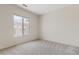 Clean bedroom with natural light and neutral carpet at 4701 W Fallen Leaf Ln, Glendale, AZ 85310