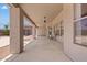 Spacious covered patio with neutral tones, offering a comfortable outdoor living space at 4701 W Fallen Leaf Ln, Glendale, AZ 85310