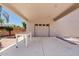 Spacious covered area leading to detached garage, offering ample space for vehicles and storage at 4701 W Fallen Leaf Ln, Glendale, AZ 85310
