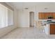 Open dining area with bar seating and natural light at 4701 W Fallen Leaf Ln, Glendale, AZ 85310
