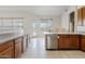 Kitchen with stainless steel dishwasher and access to the yard at 4701 W Fallen Leaf Ln, Glendale, AZ 85310
