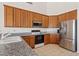 Kitchen featuring stainless steel appliances and granite countertops at 4701 W Fallen Leaf Ln, Glendale, AZ 85310