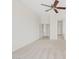 Open living room featuring plush neutral carpet and access to other rooms at 4701 W Fallen Leaf Ln, Glendale, AZ 85310