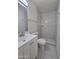 Updated bathroom featuring modern vanity, tiled shower, and neutral color palette at 4911 W Merrell St, Phoenix, AZ 85031