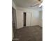Bedroom featuring neutral carpet and closet at 4911 W Merrell St, Phoenix, AZ 85031