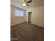 Bedroom featuring carpet, a ceiling fan, window with blinds and a closet for storage at 4911 W Merrell St, Phoenix, AZ 85031
