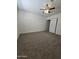 Bedroom features neutral carpet, bright lighting, and spacious closet at 4911 W Merrell St, Phoenix, AZ 85031