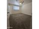 Bedroom with plush carpet and a large window for natural light at 4911 W Merrell St, Phoenix, AZ 85031