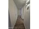 Hallway featuring sleek wood flooring and neutral color palette at 4911 W Merrell St, Phoenix, AZ 85031