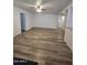 Bright living area featuring new floors and an open layout, perfect for entertaining and relaxation at 4911 W Merrell St, Phoenix, AZ 85031