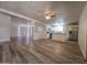 View of a bright, open living space with new wood floors, blending seamlessly into the updated kitchen at 4911 W Merrell St, Phoenix, AZ 85031