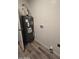 Utility room with water heater and laminate flooring at 4911 W Merrell St, Phoenix, AZ 85031