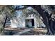 Charming home featuring a white stucco exterior, a lovely tree, and a welcoming entrance at 498 W Gail Dr, Chandler, AZ 85225