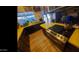 Unique kitchen featuring bright yellow countertops, dark cabinetry, and a modern stainless steel oven with gas range at 498 W Gail Dr, Chandler, AZ 85225